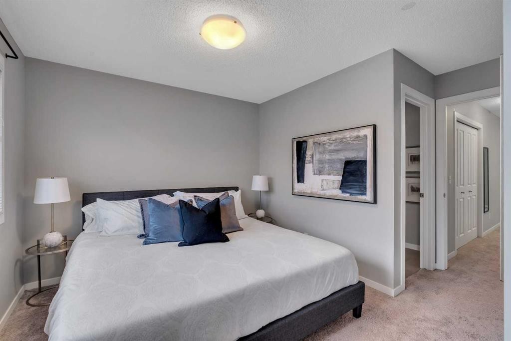 34 New Brighton Point Se, Calgary, AB - Indoor Photo Showing Bedroom