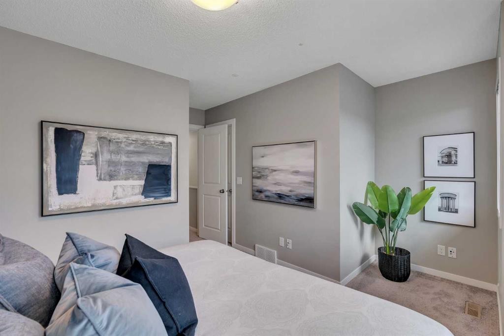 34 New Brighton Point Se, Calgary, AB - Indoor Photo Showing Bedroom