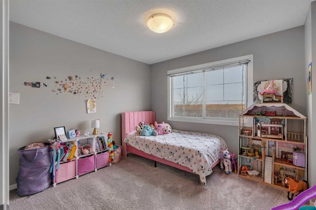 34 New Brighton Point Se, Calgary, AB - Indoor Photo Showing Bedroom