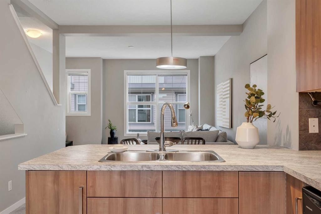 34 New Brighton Point Se, Calgary, AB - Indoor Photo Showing Kitchen With Double Sink