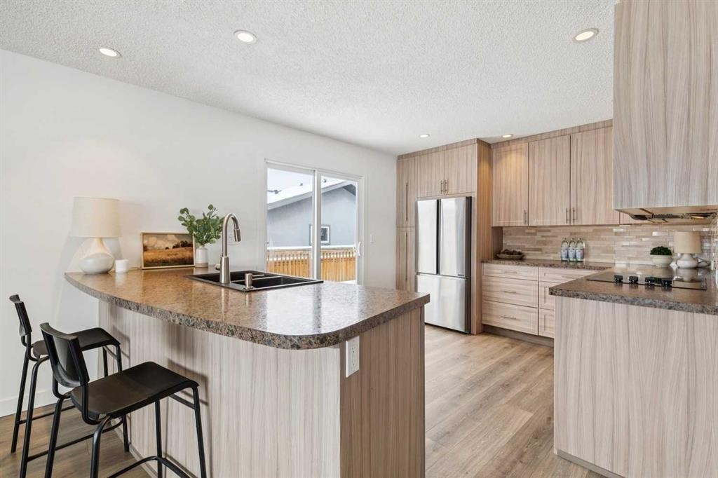 11016 Braton Place Sw, Calgary, AB - Indoor Photo Showing Kitchen With Stainless Steel Kitchen With Double Sink