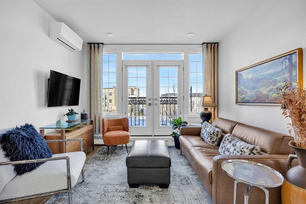 210-38 Quarry Gate Se, Calgary, AB - Indoor Photo Showing Living Room