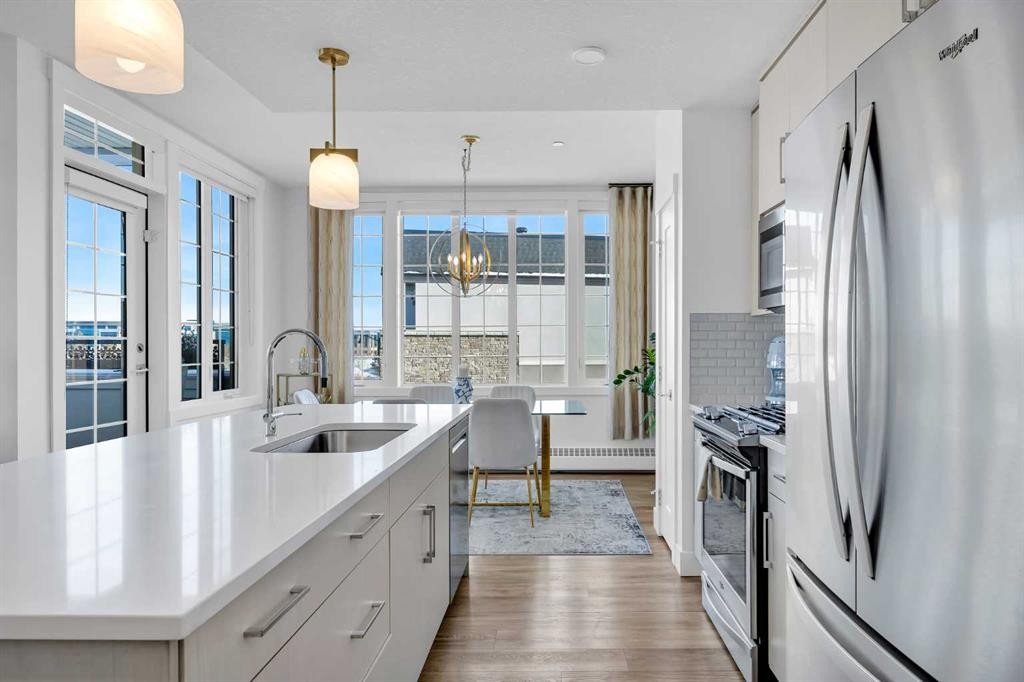 210-38 Quarry Gate Se, Calgary, AB - Indoor Photo Showing Kitchen With Upgraded Kitchen