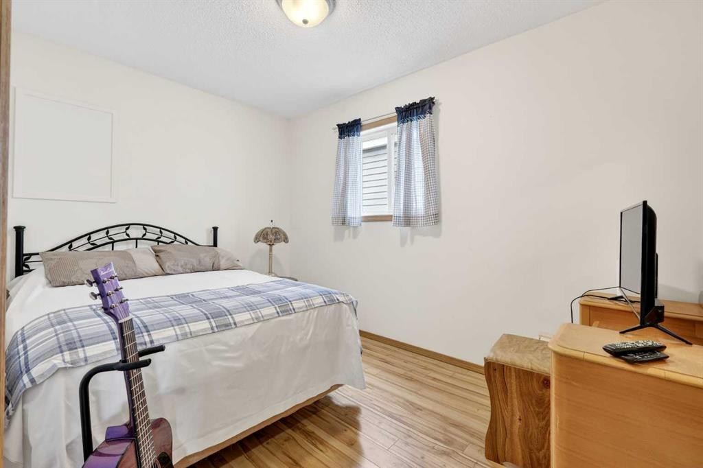 886 Erin Woods Drive Se, Calgary, AB - Indoor Photo Showing Bedroom