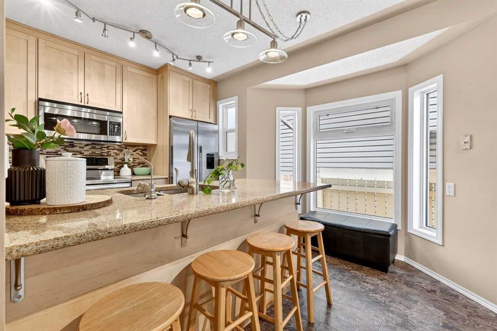 886 Erin Woods Drive Se, Calgary, AB - Indoor Photo Showing Kitchen With Double Sink
