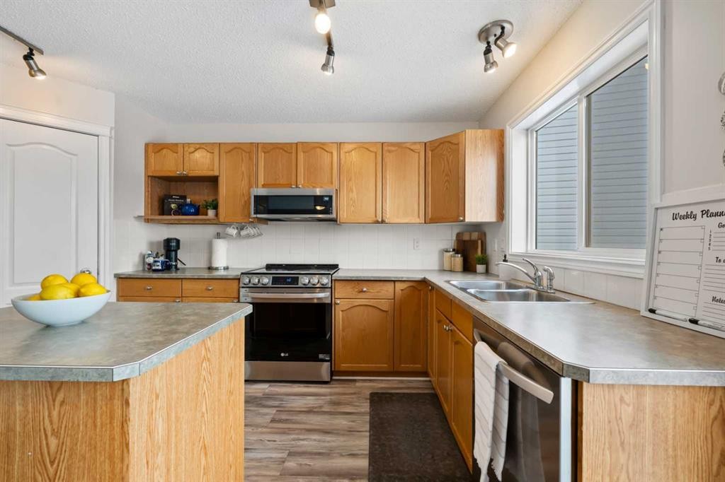 8 Chapalina Crescent Se, Calgary, AB - Indoor Photo Showing Kitchen With Double Sink