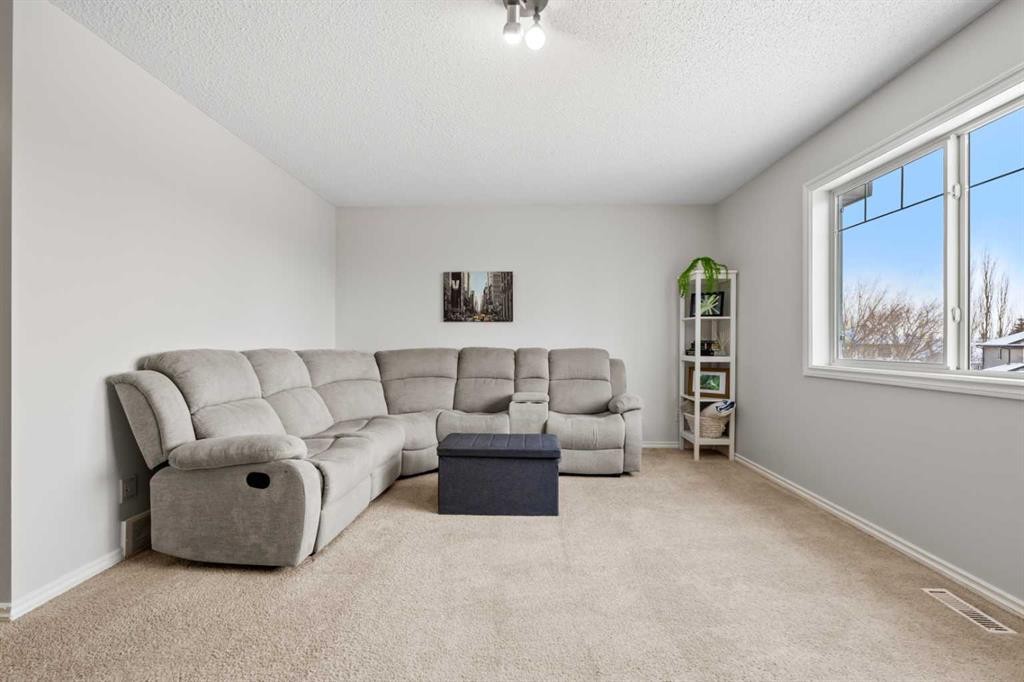 8 Chapalina Crescent Se, Calgary, AB - Indoor Photo Showing Living Room