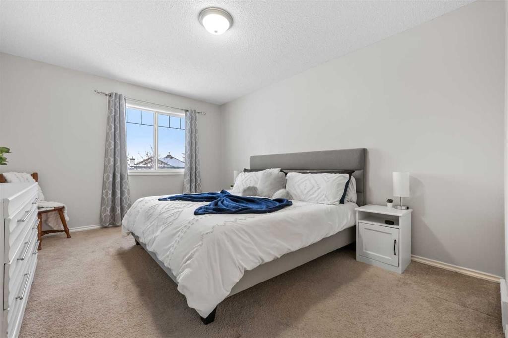 8 Chapalina Crescent Se, Calgary, AB - Indoor Photo Showing Bedroom