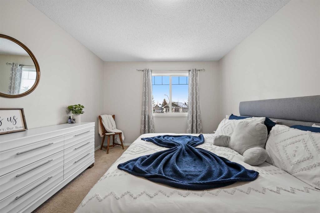 8 Chapalina Crescent Se, Calgary, AB - Indoor Photo Showing Bedroom