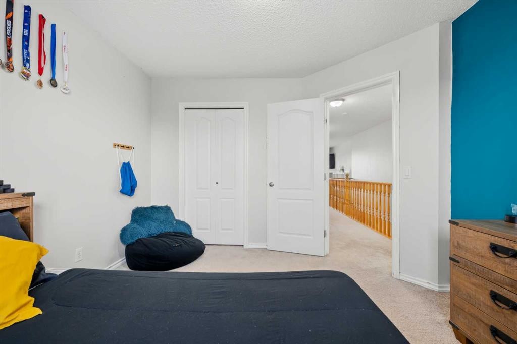 8 Chapalina Crescent Se, Calgary, AB - Indoor Photo Showing Bedroom