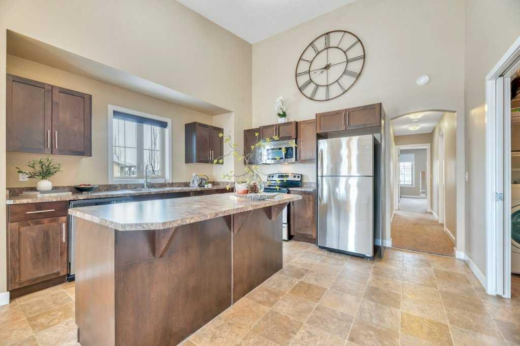 1205-230 Eversyde Boulevard Sw, Calgary, AB - Indoor Photo Showing Kitchen With Double Sink