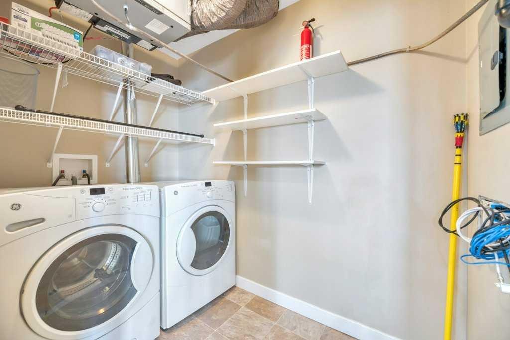 1205-230 Eversyde Boulevard Sw, Calgary, AB - Indoor Photo Showing Laundry Room