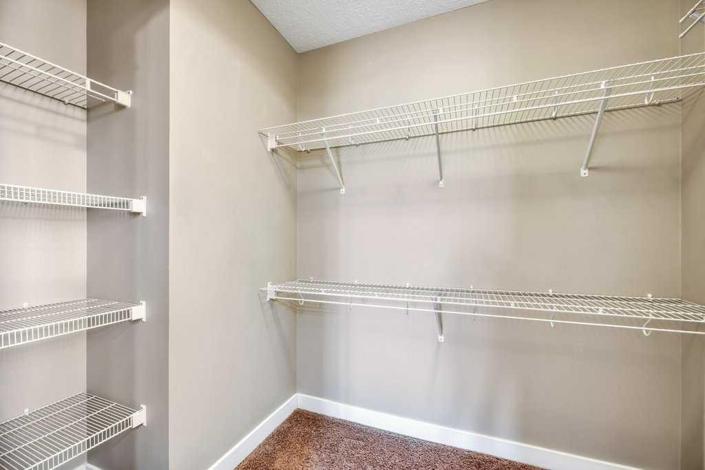 1205-230 Eversyde Boulevard Sw, Calgary, AB - Indoor With Storage