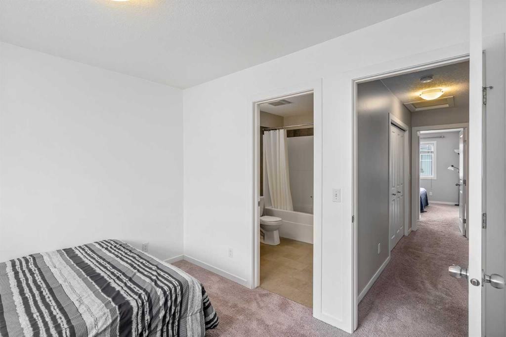37 New Brighton Point Se, Calgary, AB - Indoor Photo Showing Bedroom