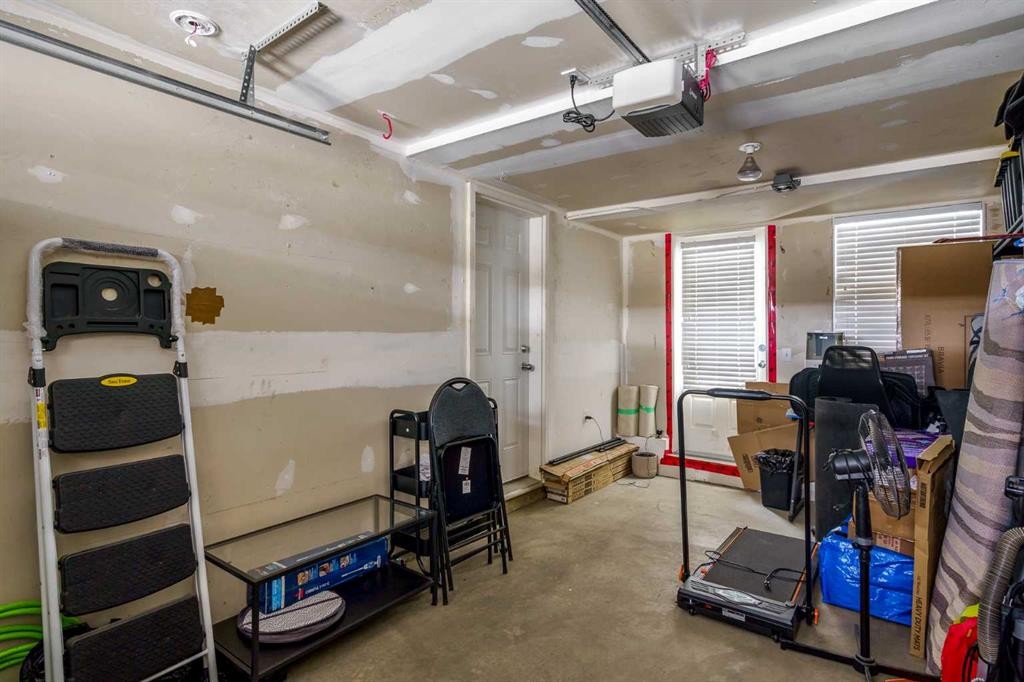 37 New Brighton Point Se, Calgary, AB - Indoor Photo Showing Garage