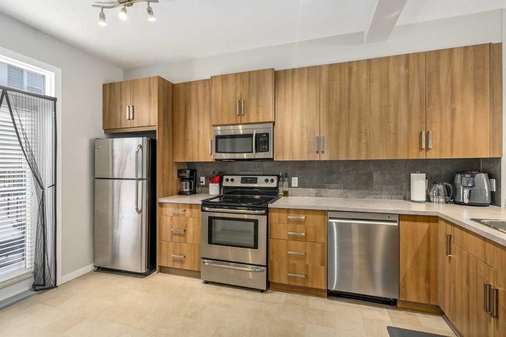 37 New Brighton Point Se, Calgary, AB - Indoor Photo Showing Kitchen With Stainless Steel Kitchen