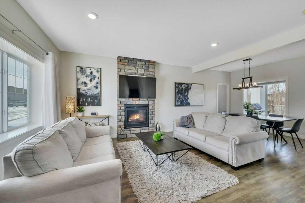 57 Hampton Crescent, Sylvan Lake, AB - Indoor Photo Showing Living Room With Fireplace