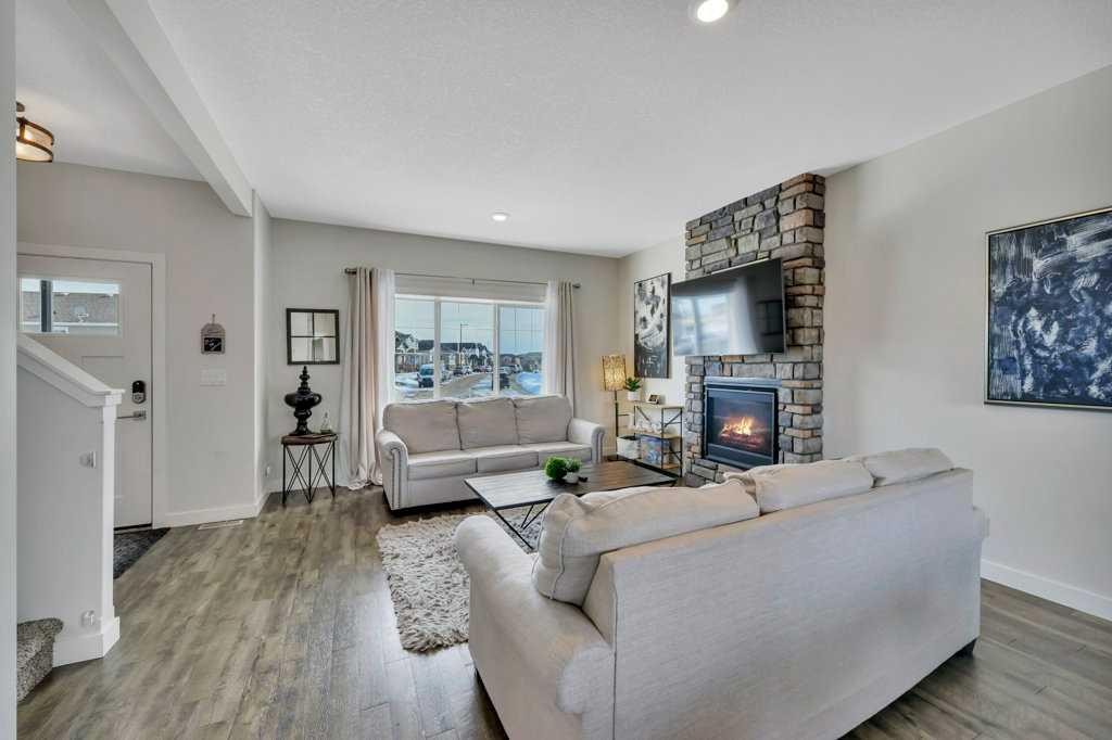 57 Hampton Crescent, Sylvan Lake, AB - Indoor Photo Showing Living Room With Fireplace