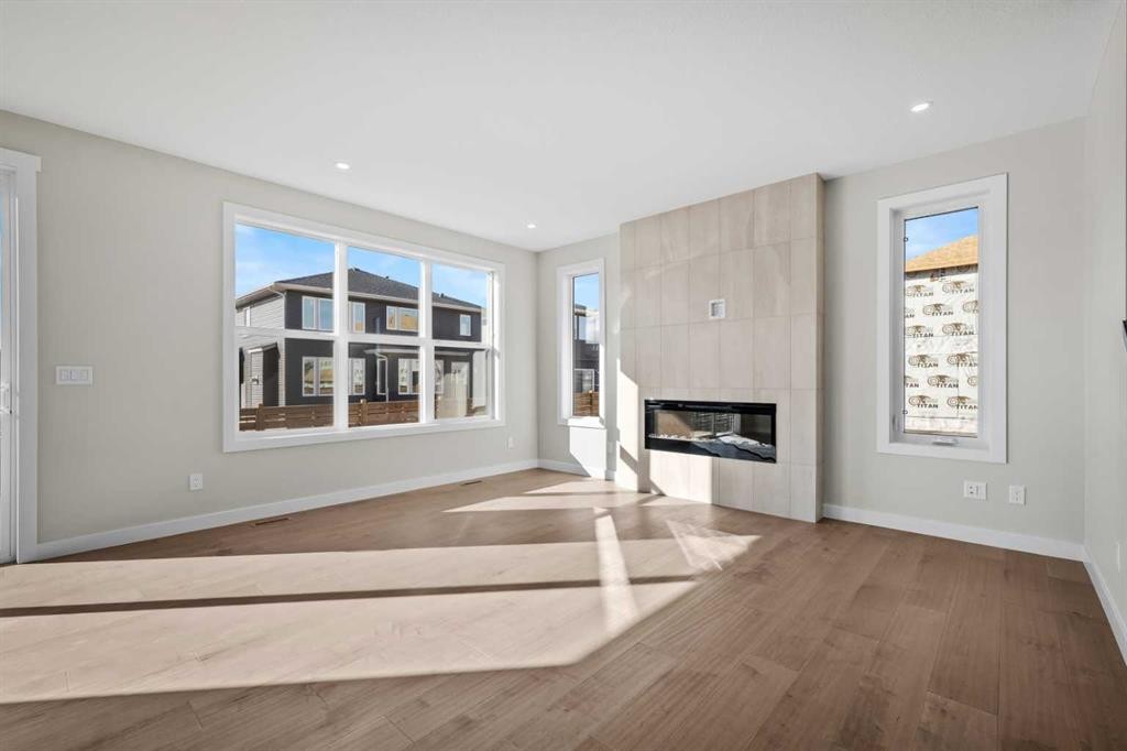 151 Dawson Wharf Mount, Chestermere, AB - Indoor Photo Showing Living Room With Fireplace