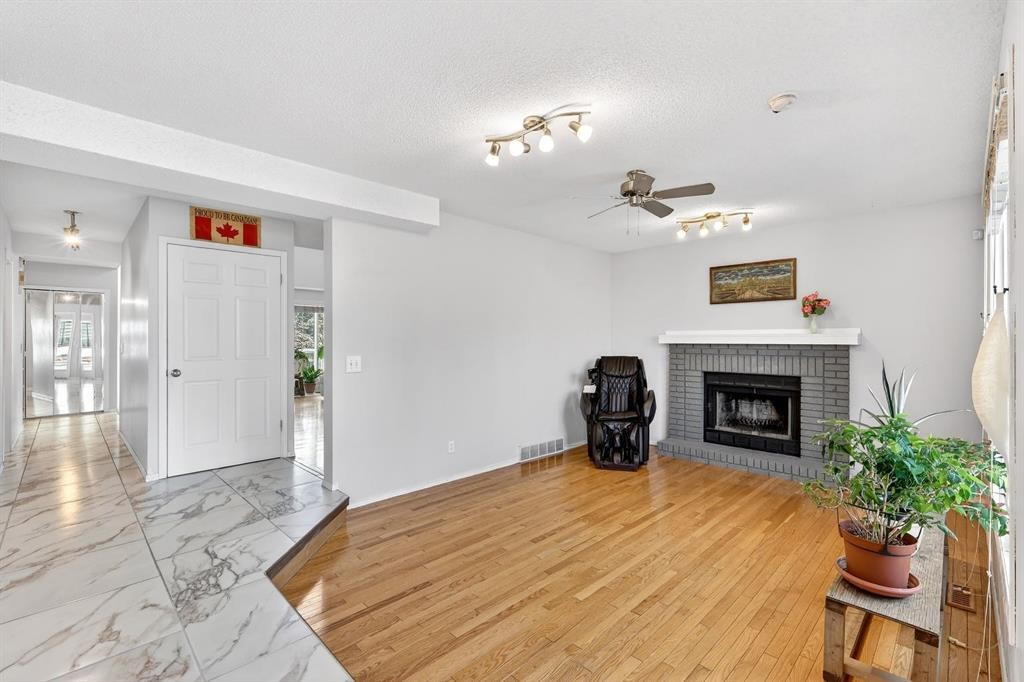 29 Sundown Way Se, Calgary, AB - Indoor Photo Showing Living Room With Fireplace