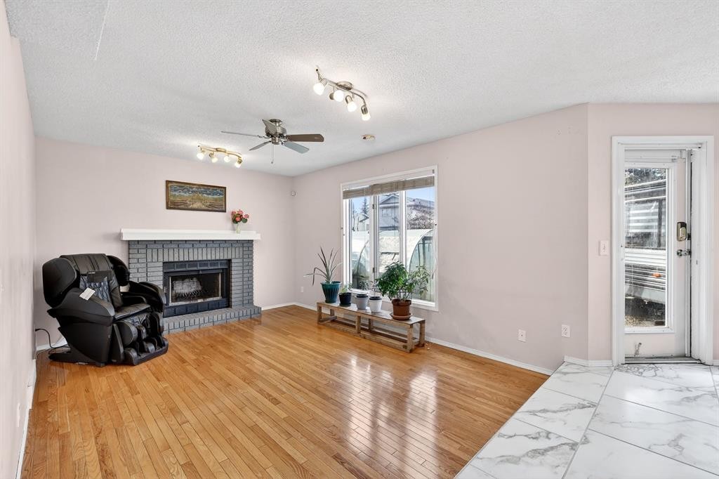 29 Sundown Way Se, Calgary, AB - Indoor Photo Showing Living Room With Fireplace