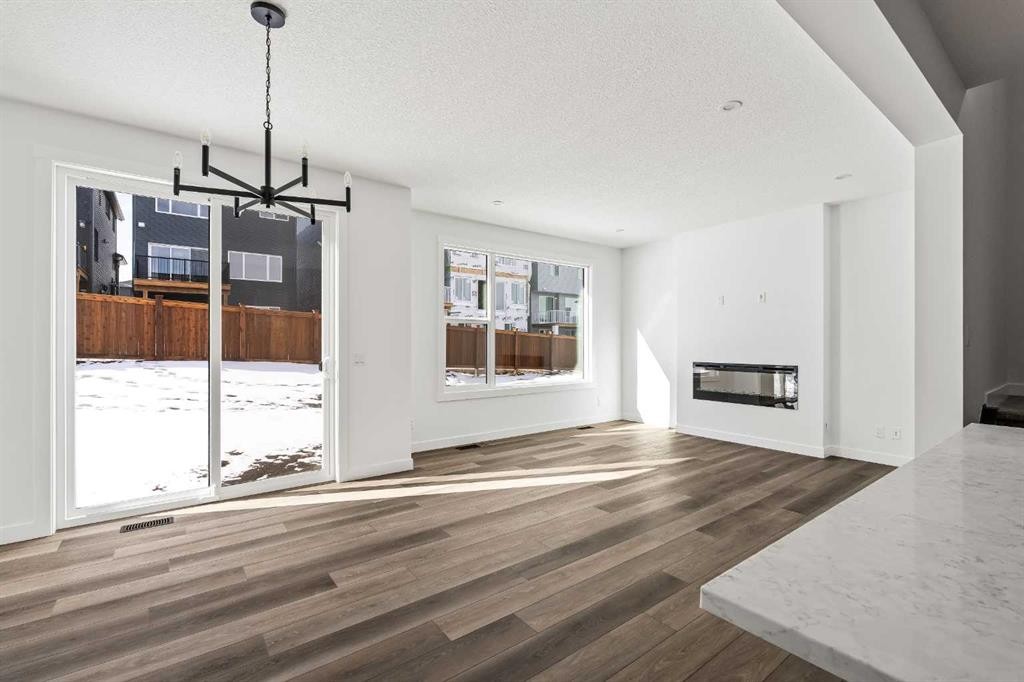 49 Starling Passage Nw, Calgary, AB - Indoor Photo Showing Living Room With Fireplace