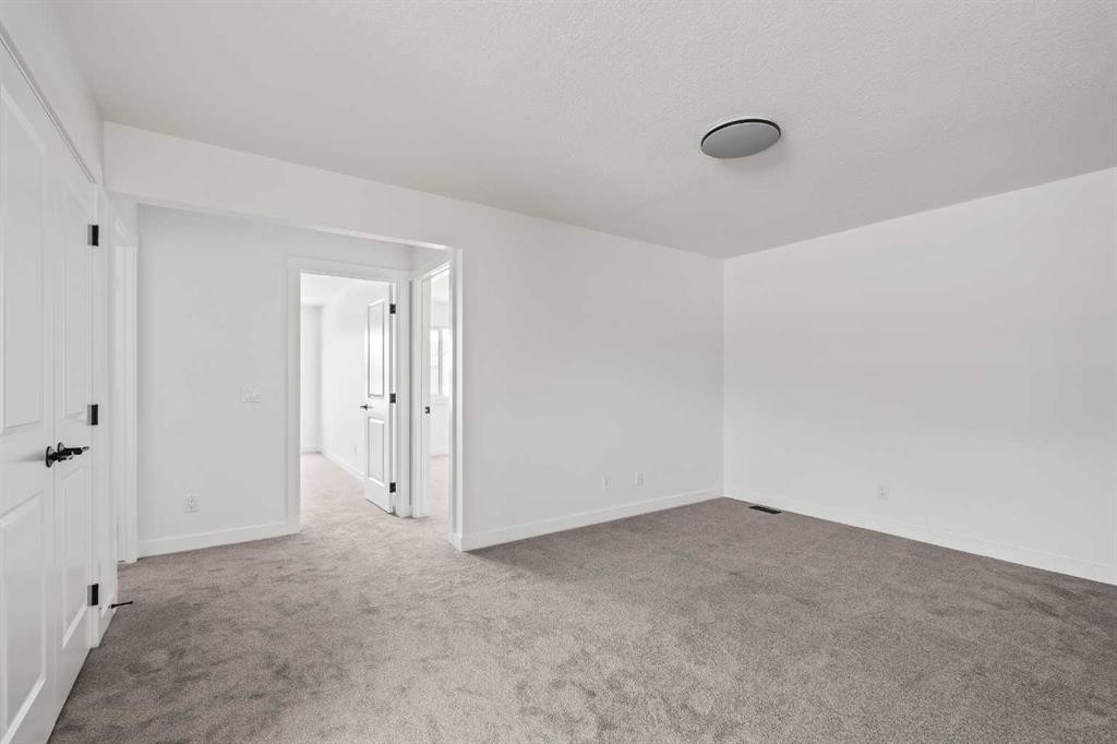 49 Starling Passage Nw, Calgary, AB - Indoor Photo Showing Other Room