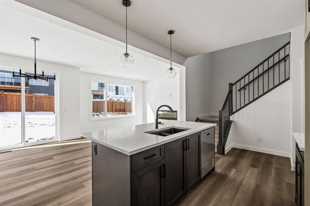 49 Starling Passage Nw, Calgary, AB - Indoor Photo Showing Kitchen With Double Sink