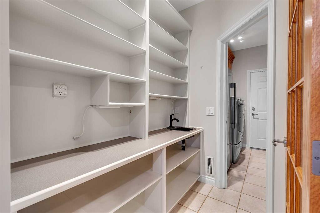 52 Sandstone Ridge Crescent, Okotoks, AB - Indoor With Storage