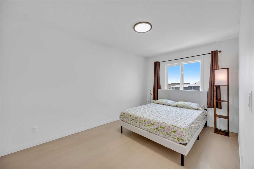 76 Edith Mews Nw, Calgary, AB - Indoor Photo Showing Bedroom