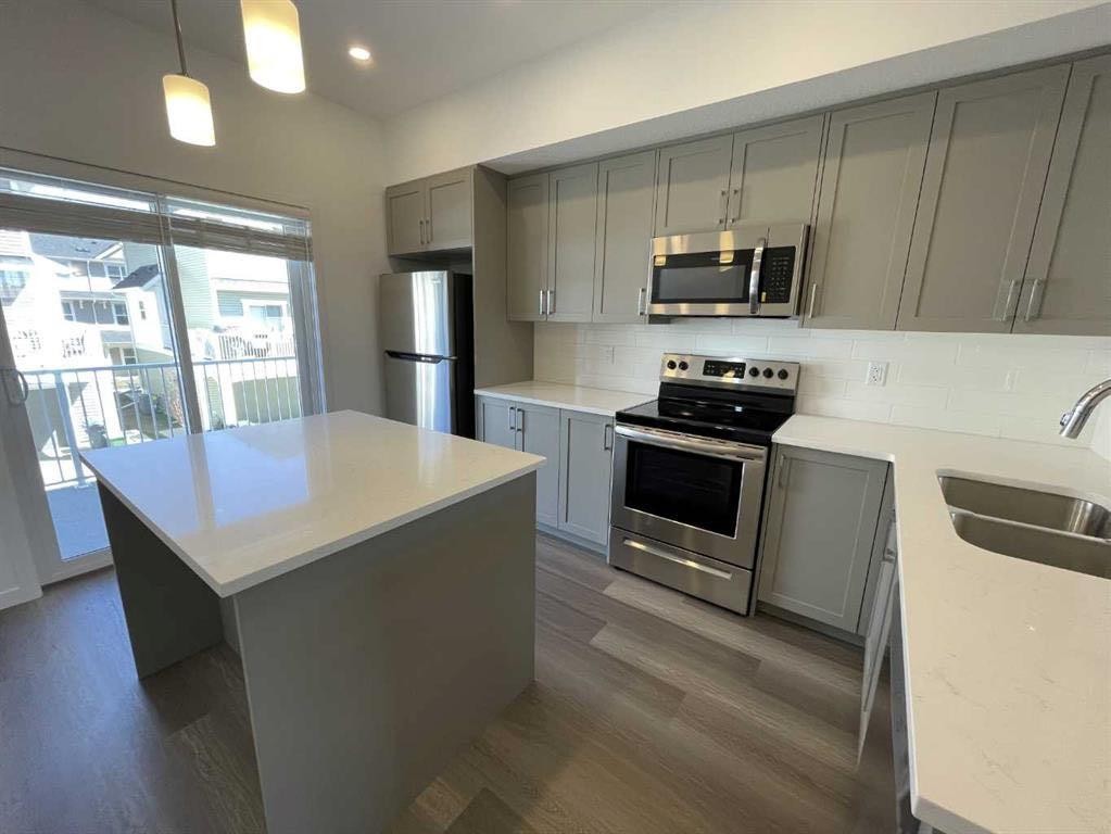 505 Copperstone Manor Se, Calgary, AB - Indoor Photo Showing Kitchen With Stainless Steel Kitchen With Double Sink