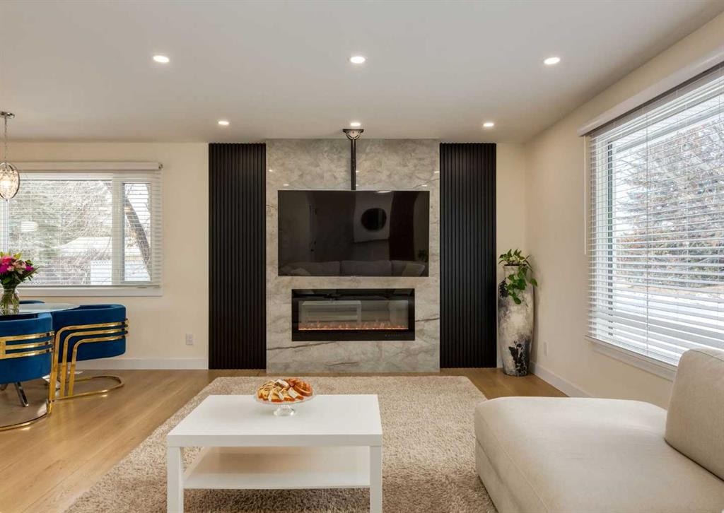 5219 Valiant Drive Nw, Calgary, AB - Indoor Photo Showing Living Room With Fireplace