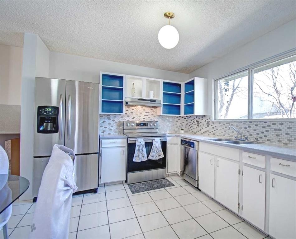 6307 Thornaby Way Nw, Calgary, AB - Indoor Photo Showing Kitchen With Stainless Steel Kitchen With Double Sink