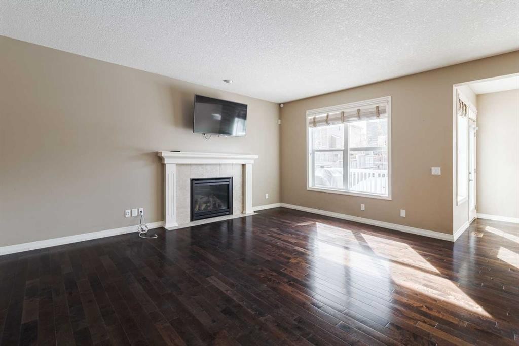 115 Auburn Glen Way Se, Calgary, AB - Indoor Photo Showing Living Room With Fireplace