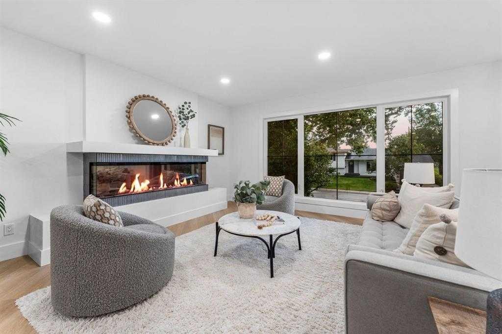 10404 Maplemont Road Se, Calgary, AB - Indoor Photo Showing Living Room With Fireplace