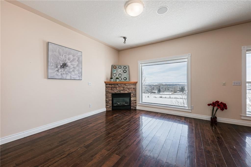 144 Rocky Vista Terrace Nw, Calgary, AB - Indoor Photo Showing Living Room With Fireplace