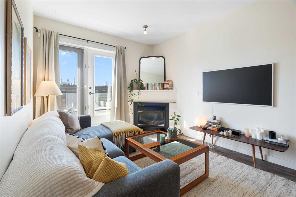 406-830 Centre Avenue Ne, Calgary, AB - Indoor Photo Showing Living Room With Fireplace