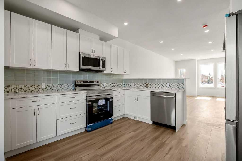 409 Strathcona Circle, Strathmore, AB - Indoor Photo Showing Kitchen With Stainless Steel Kitchen With Upgraded Kitchen