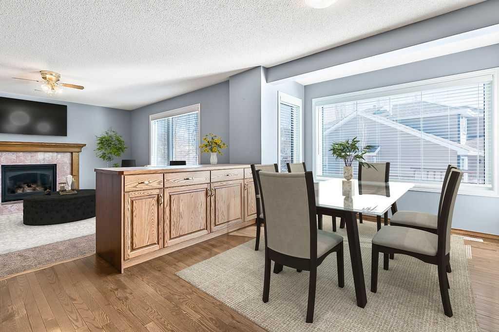 303 Schubert Place Nw, Calgary, AB - Indoor Photo Showing Other Room With Fireplace