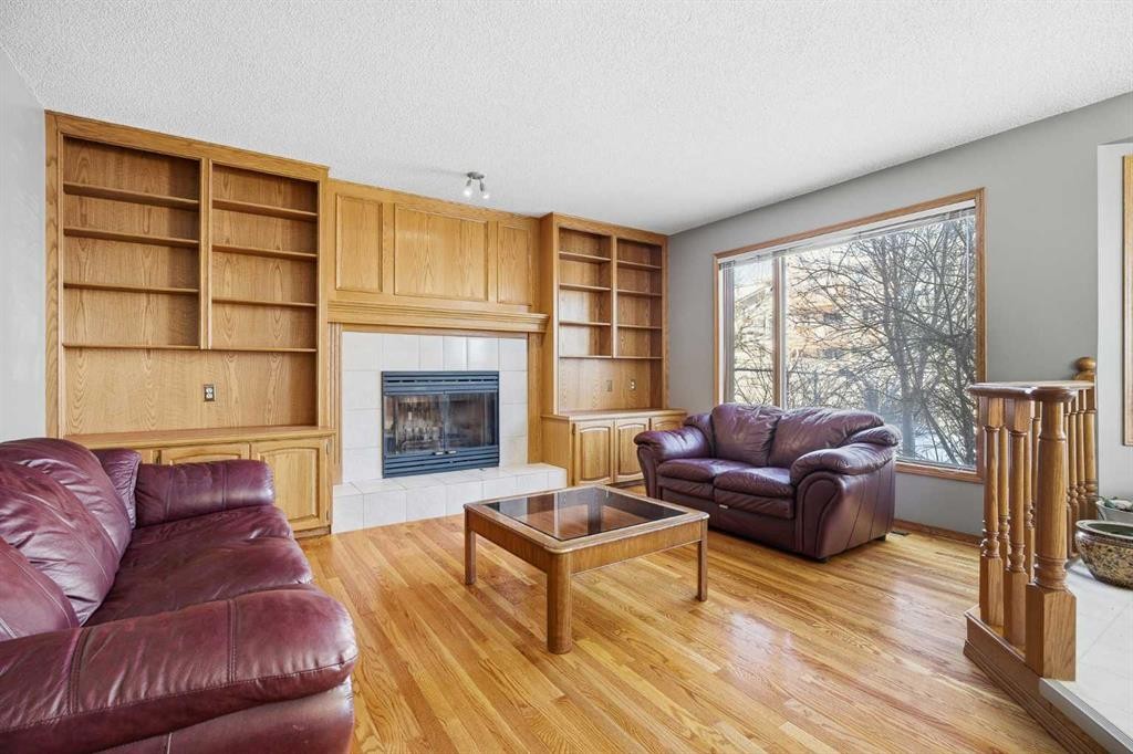 146 Hawkdale Circle Nw, Calgary, AB - Indoor Photo Showing Living Room With Fireplace