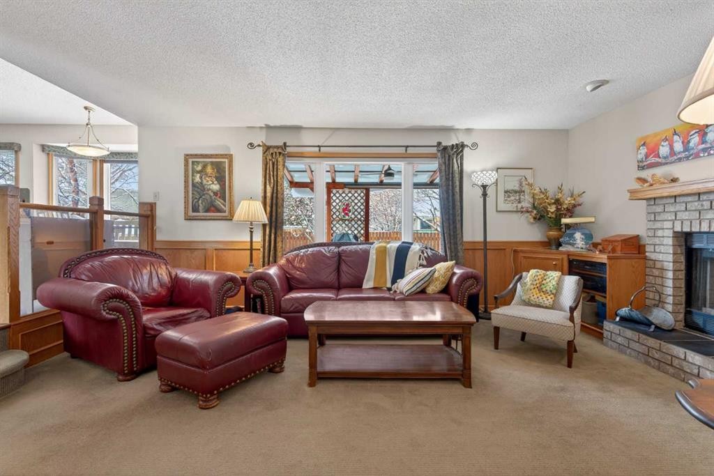 204 Sunrise Circle Se, Calgary, AB - Indoor Photo Showing Living Room With Fireplace