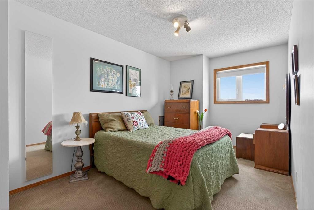 204 Sunrise Circle Se, Calgary, AB - Indoor Photo Showing Bedroom