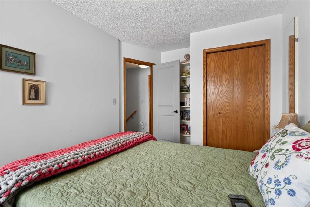 204 Sunrise Circle Se, Calgary, AB - Indoor Photo Showing Bedroom