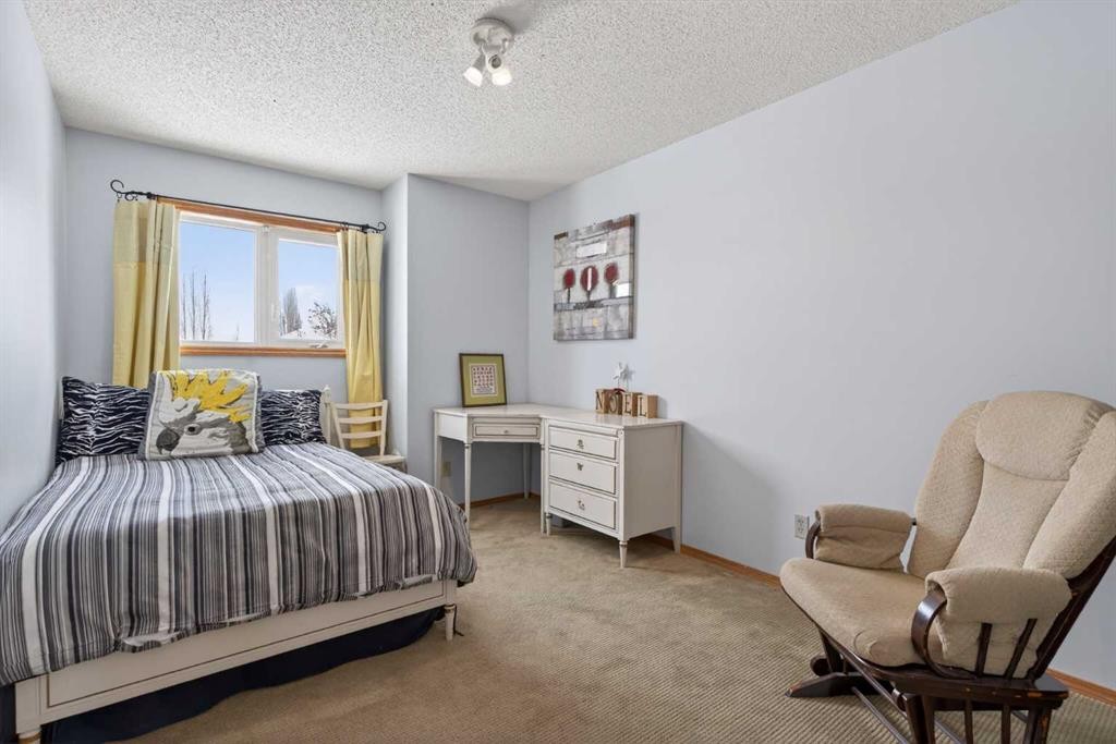 204 Sunrise Circle Se, Calgary, AB - Indoor Photo Showing Bedroom