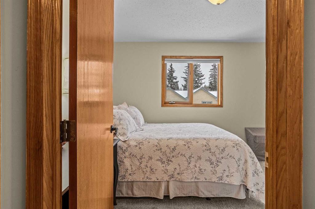 12-9 Blackrock Crescent West, Canmore, AB - Indoor Photo Showing Bedroom