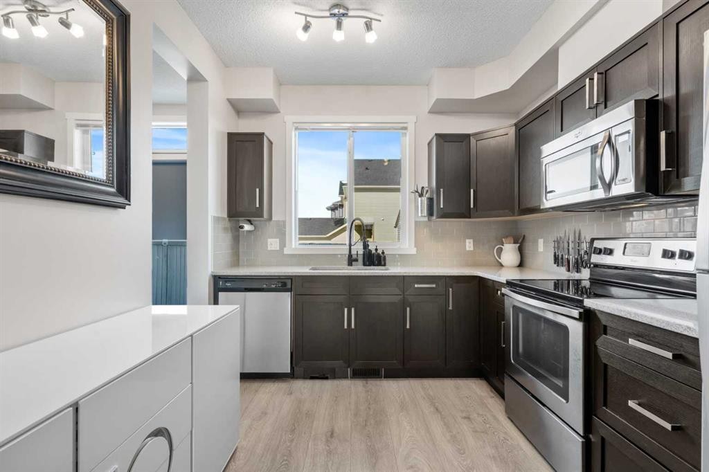 56 Legacy Main Street Se, Calgary, AB - Indoor Photo Showing Kitchen With Upgraded Kitchen