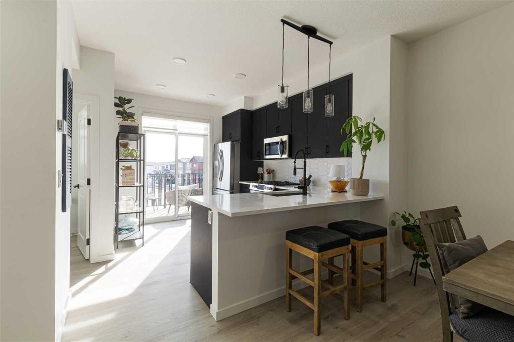 74 Spring Willow Close Sw, Calgary, AB - Indoor Photo Showing Kitchen With Upgraded Kitchen