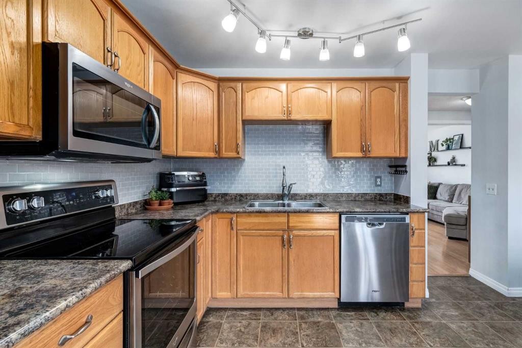 955 Erin Woods Drive Se, Calgary, AB - Indoor Photo Showing Kitchen With Stainless Steel Kitchen With Double Sink