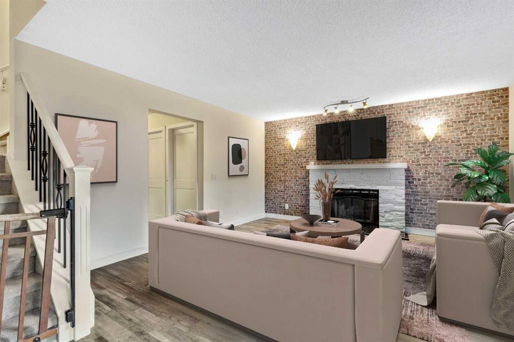 224 Macewan Ridge Close Nw, Calgary, AB - Indoor Photo Showing Living Room With Fireplace