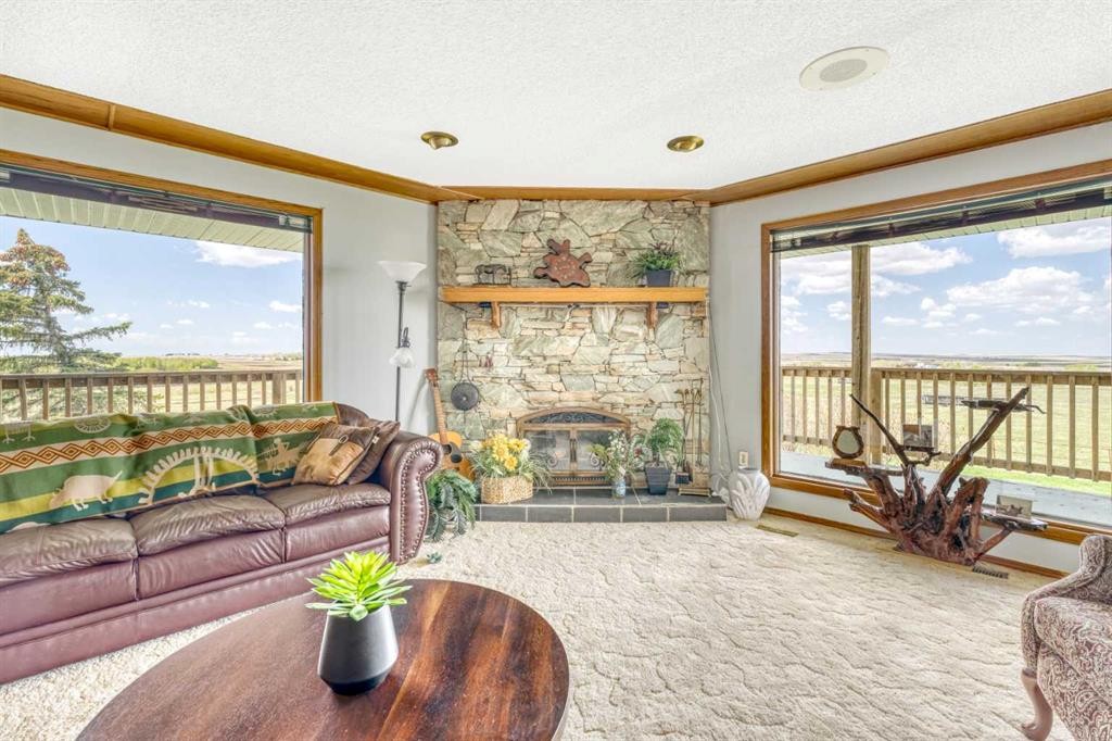 185038 Range Road 241, Milo, AB - Indoor Photo Showing Living Room With Fireplace